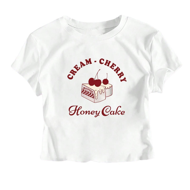 Dame Crop-T-Shirt med kreativ dessertmotiv och modern skärning Mirla-Eva Jonsson
