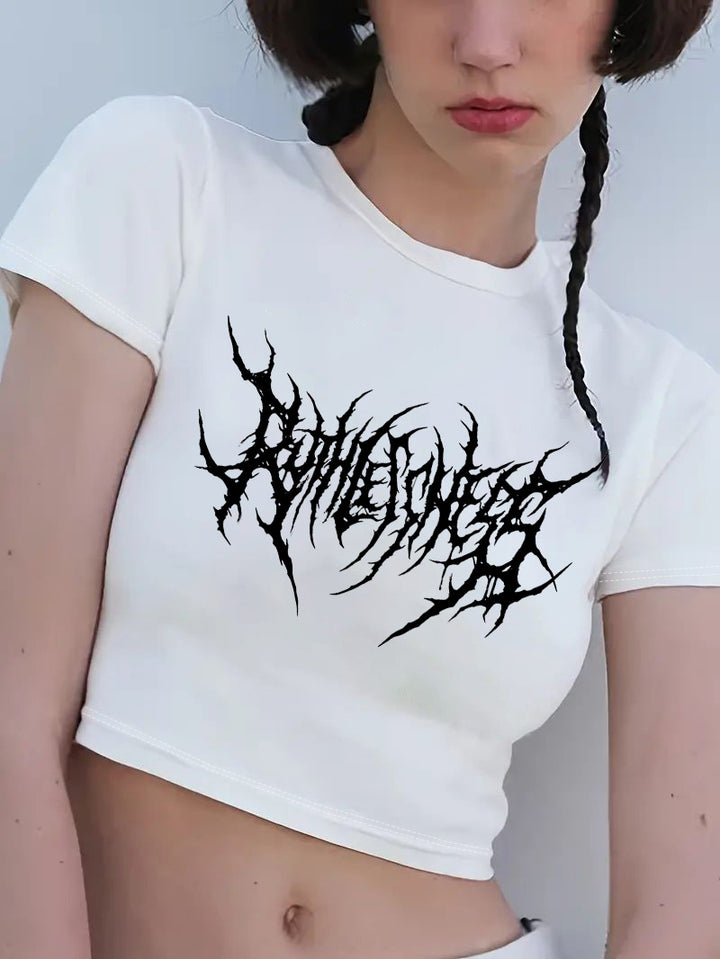 Dame Crop-T-shirt med lekfullt körsbärsmotiv och elegant rosetttryck Mirla-Eva Jonsson