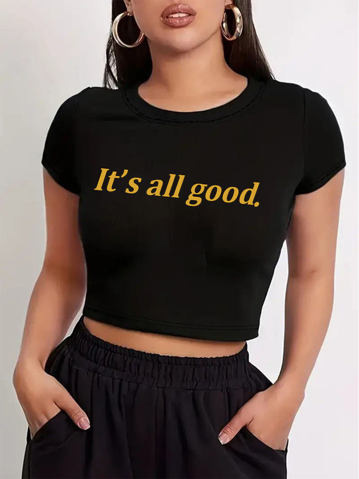 Dame Crop-T-shirt med lekfullt körsbärsmotiv och elegant rosetttryck Mirla-Eva Jonsson