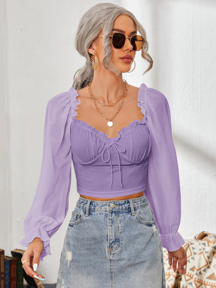 Dame Cropped-blus med volanger och eleganta puffärmar Mirla-Eva Jonsson