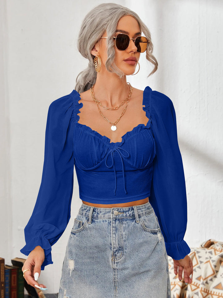 Dame Cropped-blus med volanger och eleganta puffärmar Mirla-Eva Jonsson