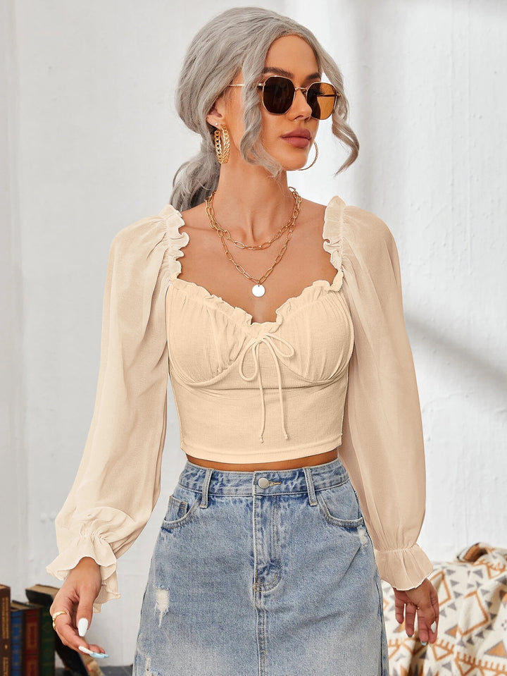 Dame Cropped-blus med volanger och eleganta puffärmar Mirla-Eva Jonsson