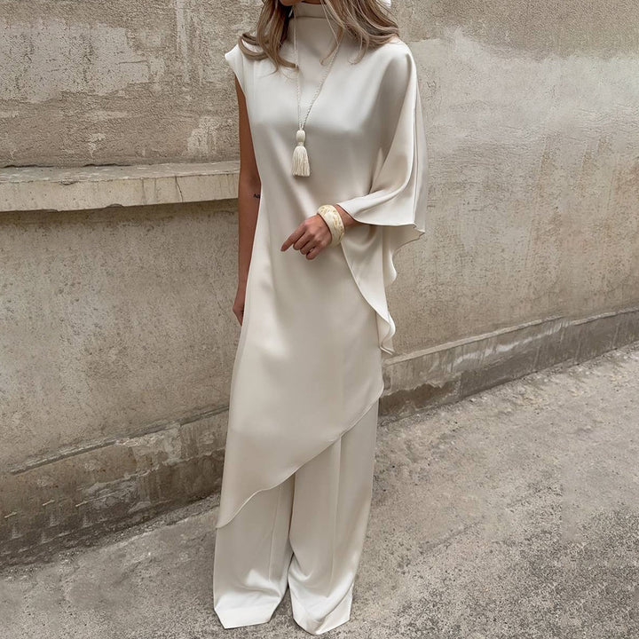 Dame Elegant asymmetrisk klänning med hög krage och sidoflärp Mirla-Eva Jonsson