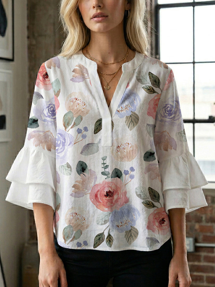 Dame Elegant topp med voluminösa puffärmar och blommönster Mirla-Eva Jonsson
