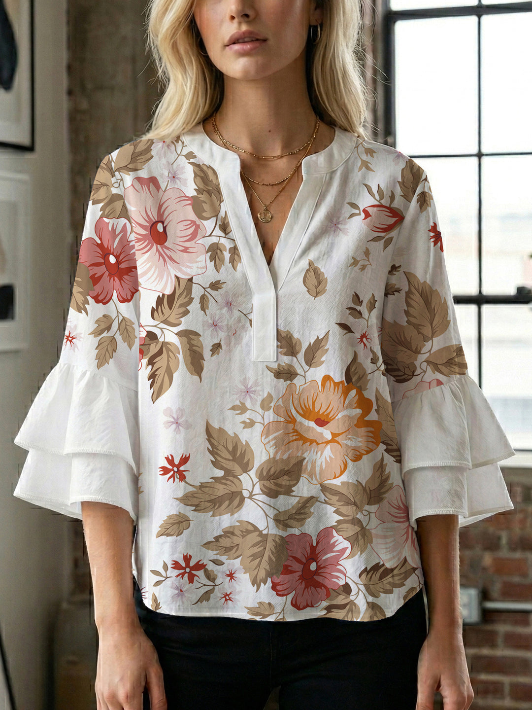 Dame Elegant topp med voluminösa puffärmar och blommönster Mirla-Eva Jonsson