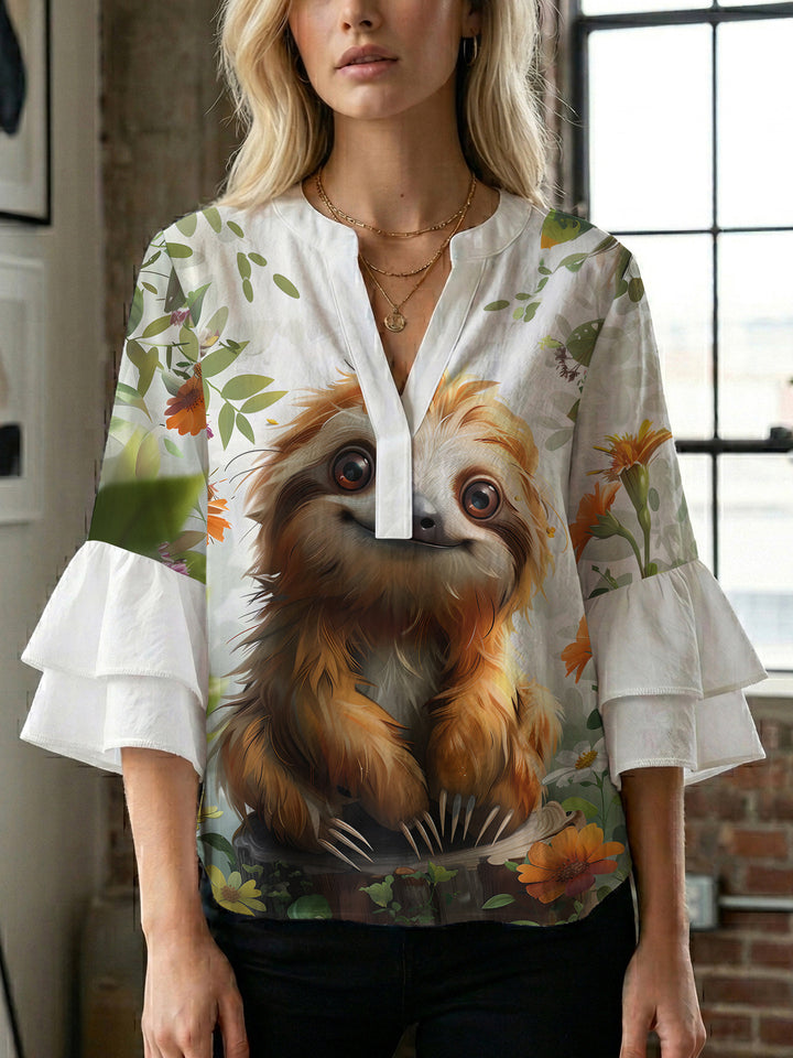 Dame Elegant topp med voluminösa puffärmar och blommönster Mirla-Eva Jonsson
