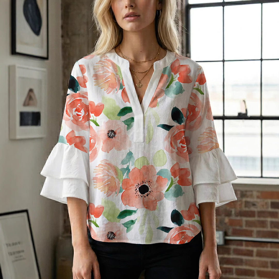 Dame Elegant topp med voluminösa puffärmar och blommönster Mirla-Eva Jonsson