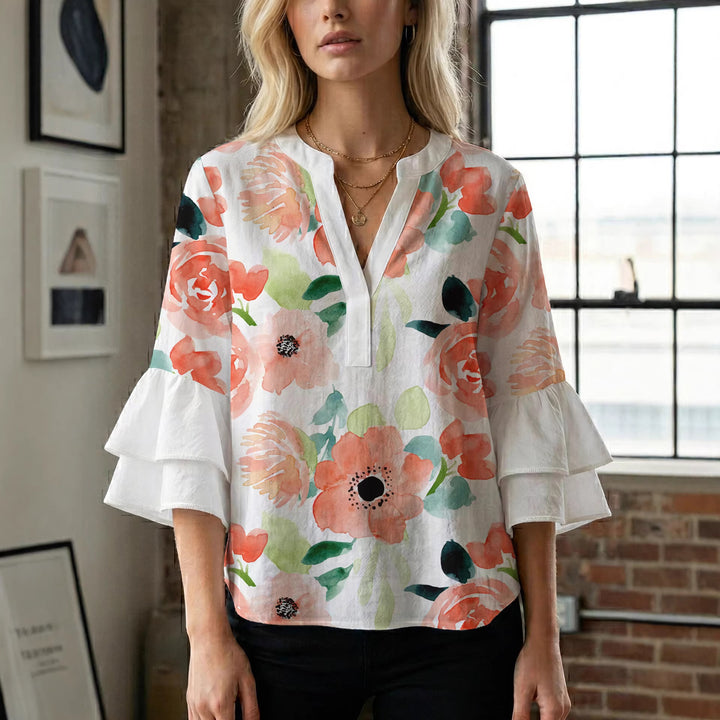 Dame Elegant topp med voluminösa puffärmar och blommönster Mirla-Eva Jonsson