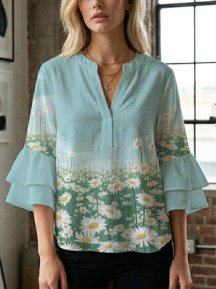 Dame Elegant topp med voluminösa puffärmar och blommönster Mirla-Eva Jonsson