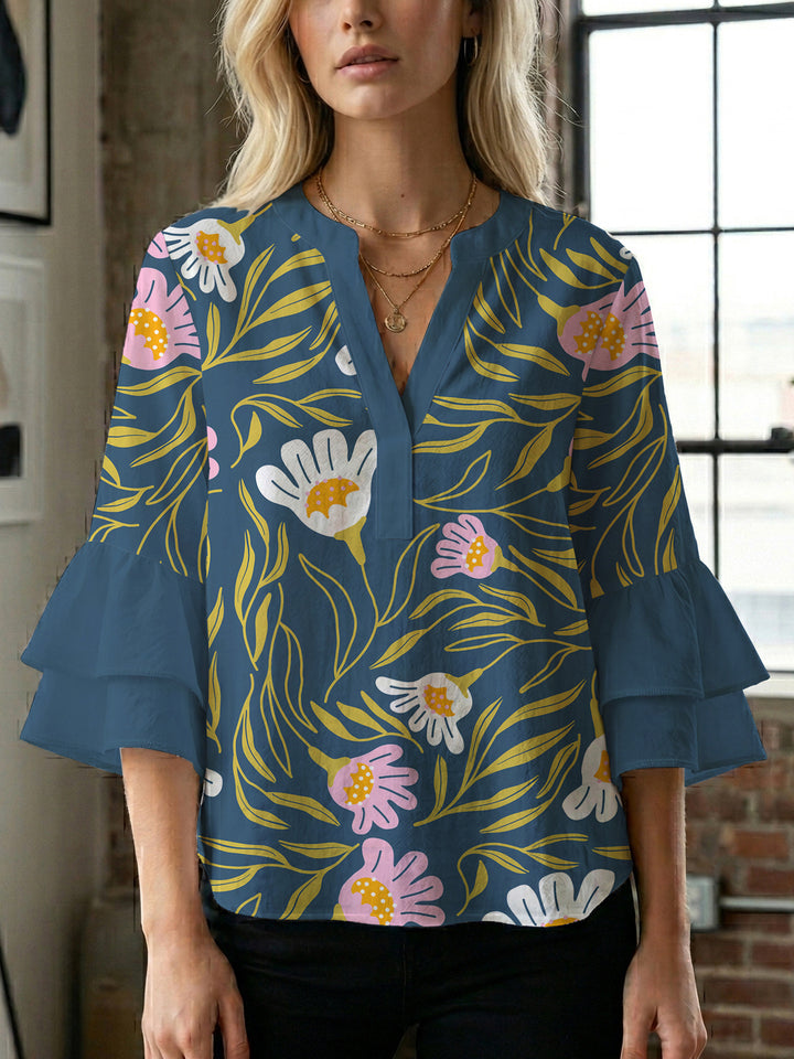 Dame Elegant topp med voluminösa puffärmar och blommönster Mirla-Eva Jonsson