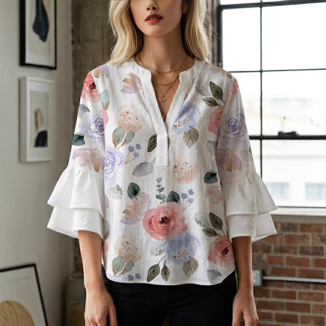 Dame Elegant topp med voluminösa puffärmar och blommönster Mirla-Eva Jonsson