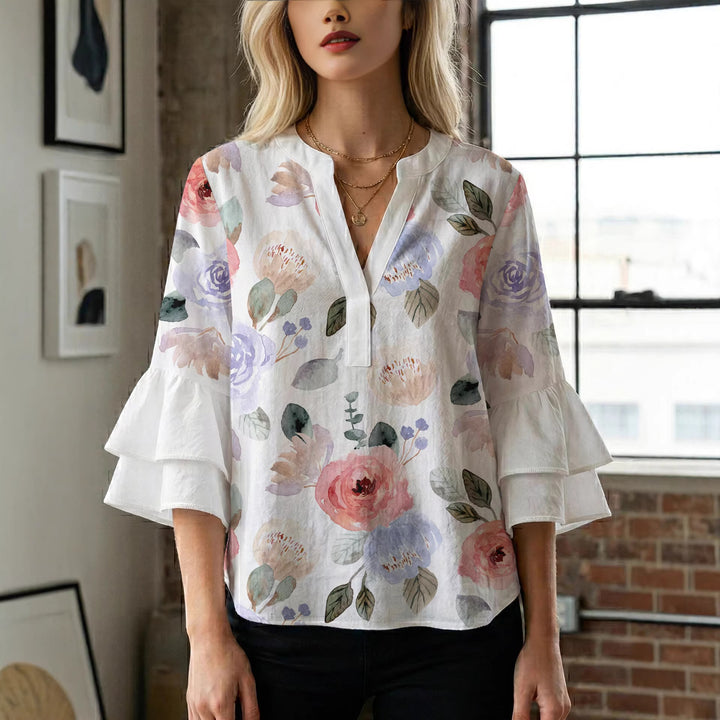 Dame Elegant topp med voluminösa puffärmar och blommönster Mirla-Eva Jonsson