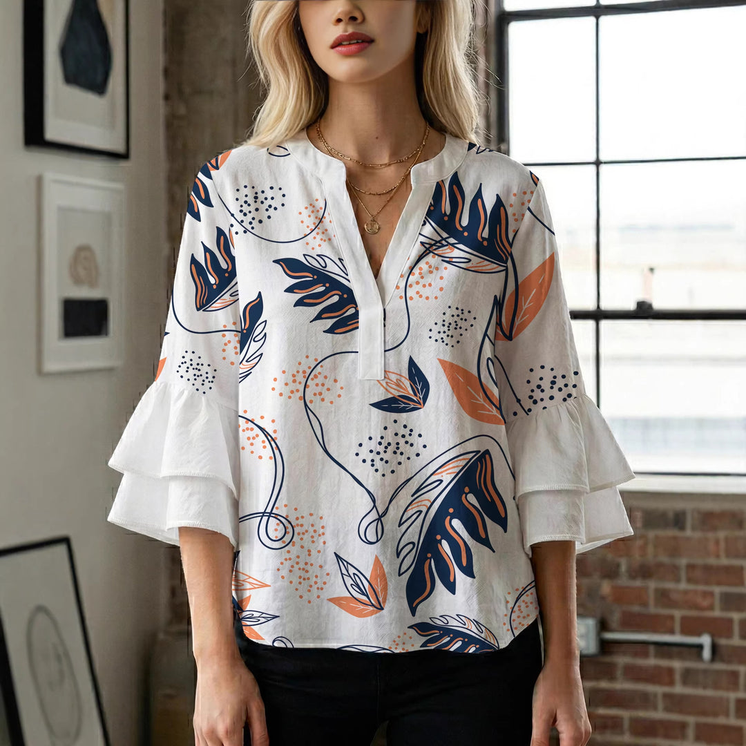 Dame Elegant topp med voluminösa puffärmar och blommönster Mirla-Eva Jonsson