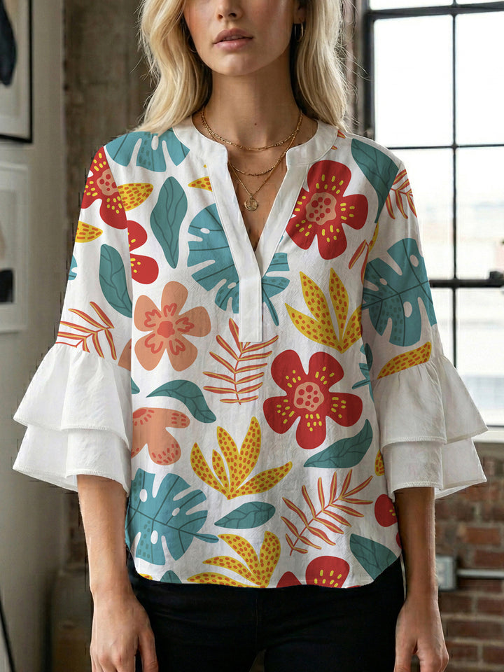 Dame Elegant topp med voluminösa puffärmar och blommönster Mirla-Eva Jonsson