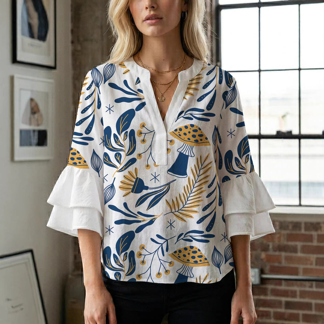 Dame Elegant topp med voluminösa puffärmar och blommönster Mirla-Eva Jonsson