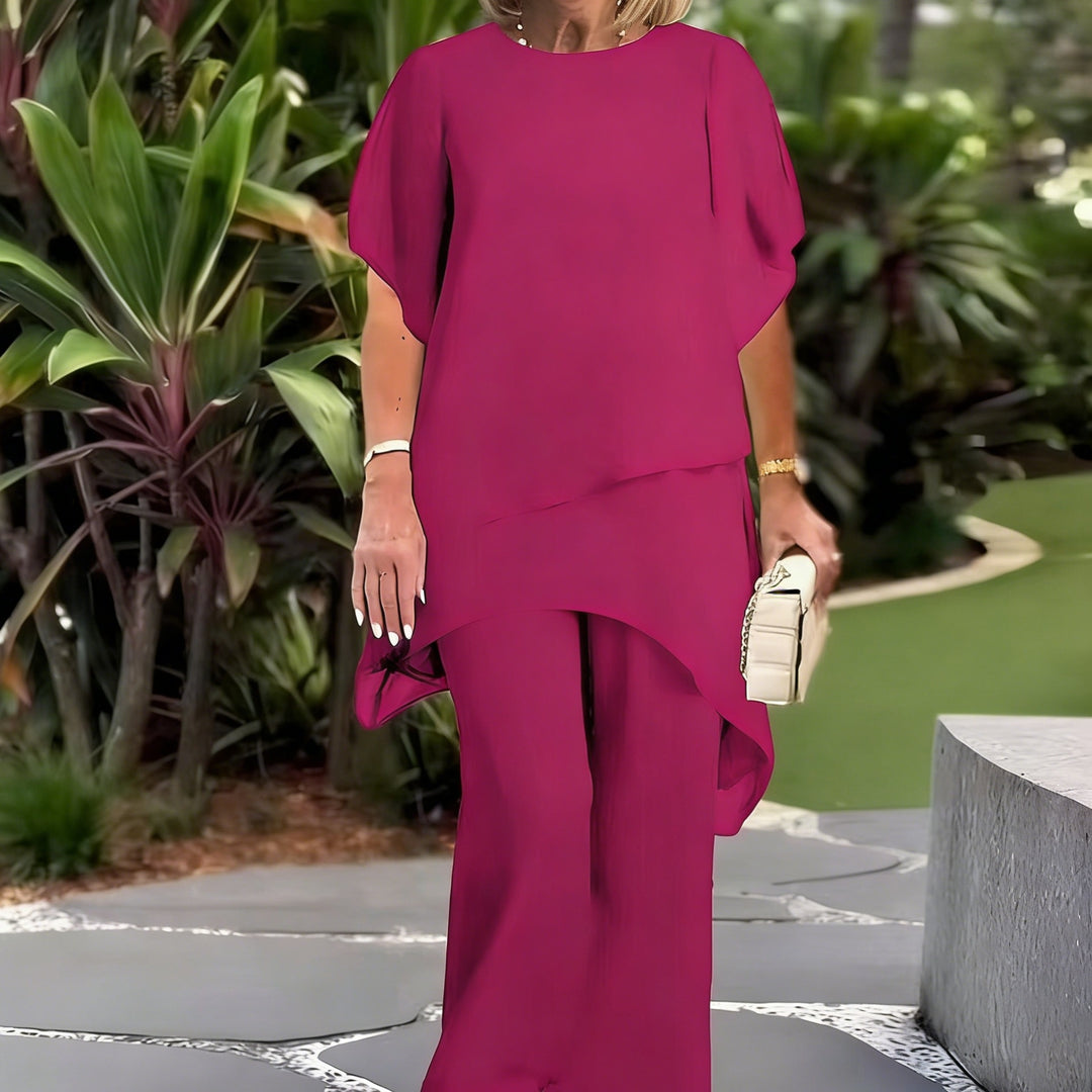 Dame Elegant tvådelad set med luftiga ärmar och asymmetrisk fåll Mirla-Eva Jonsson