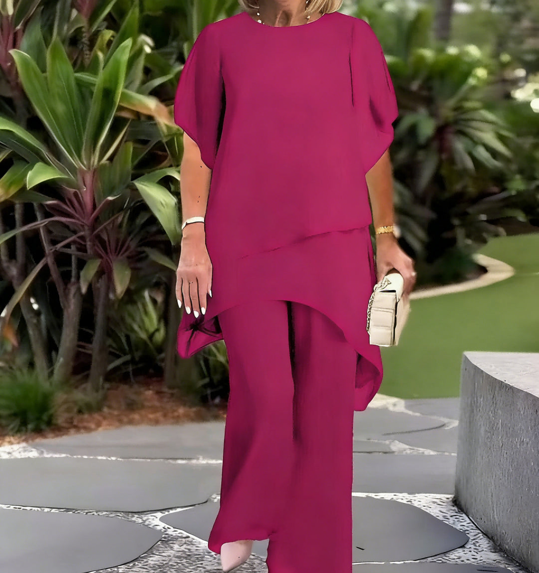 Dame Elegant tvådelad set med luftiga ärmar och asymmetrisk fåll Mirla-Eva Jonsson
