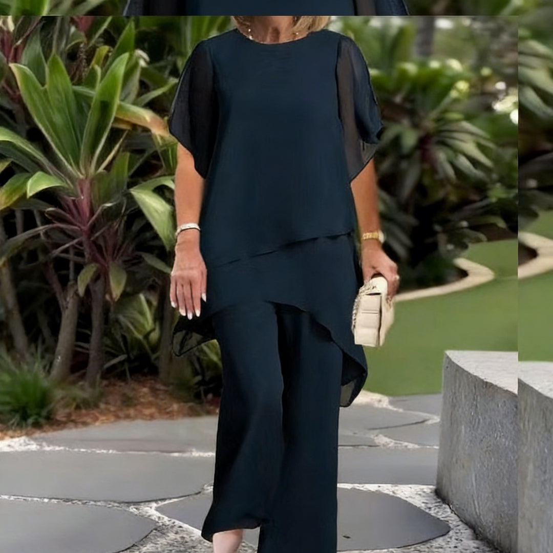 Dame Elegant tvådelad set med luftiga ärmar och asymmetrisk fåll Mirla-Eva Jonsson