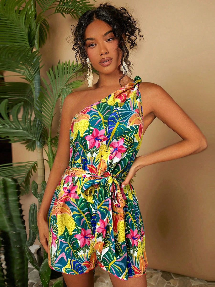 Dame En Axel Playsuit med blommönster och midjeskärp Mirla-Eva Jonsson