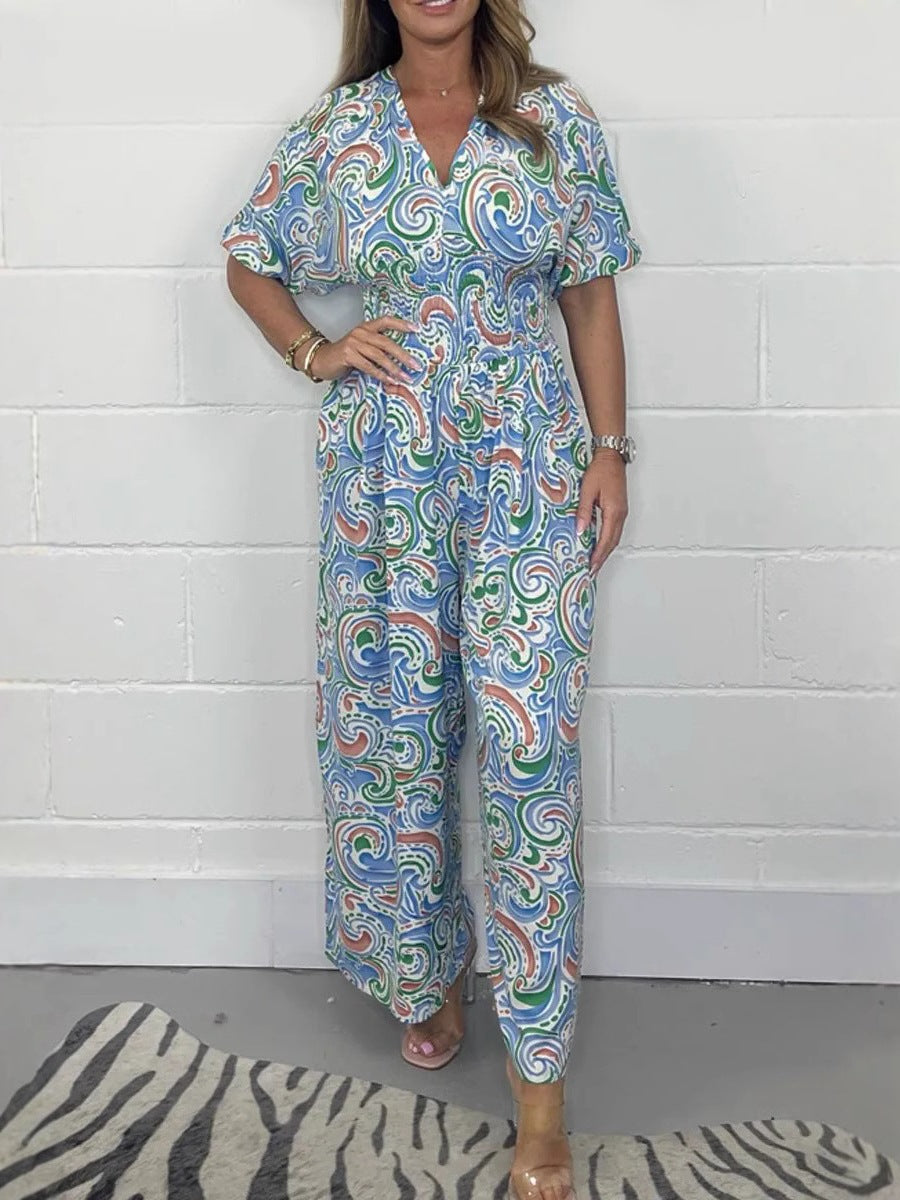 Dame Flödande Jumpsuit med elegant paisleymönster och midjeformning Mirla-Eva Jonsson