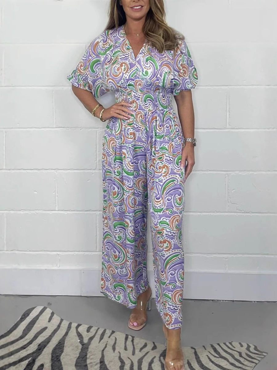Dame Flödande Jumpsuit med elegant paisleymönster och midjeformning Mirla-Eva Jonsson