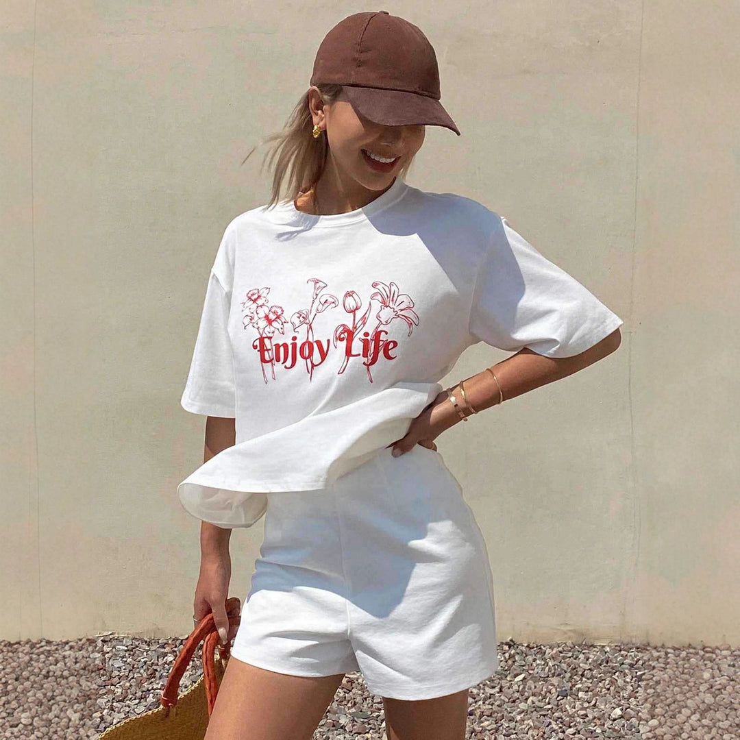 Dame Lätt oversized T-shirt med blommönster och inspirerande text Mirla-Eva Jonsson