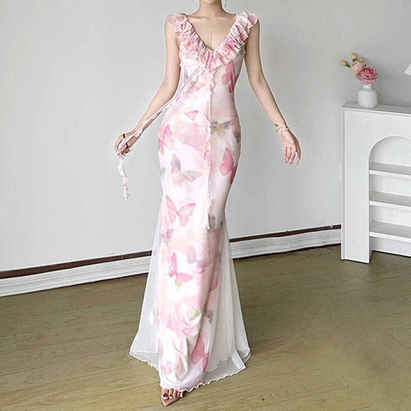 Dame Maxiklänning i genomskinlig chiffon med volangdetaljer och blommönster Mirla-Eva Jonsson