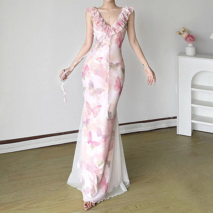 Dame Maxiklänning i genomskinlig chiffon med volangdetaljer och blommönster Mirla-Eva Jonsson