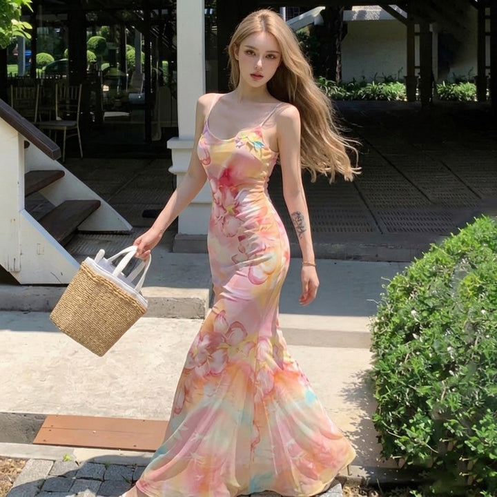 Dame Maxiklänning med blommigt mönster och spaghettiband Mirla-Eva Jonsson