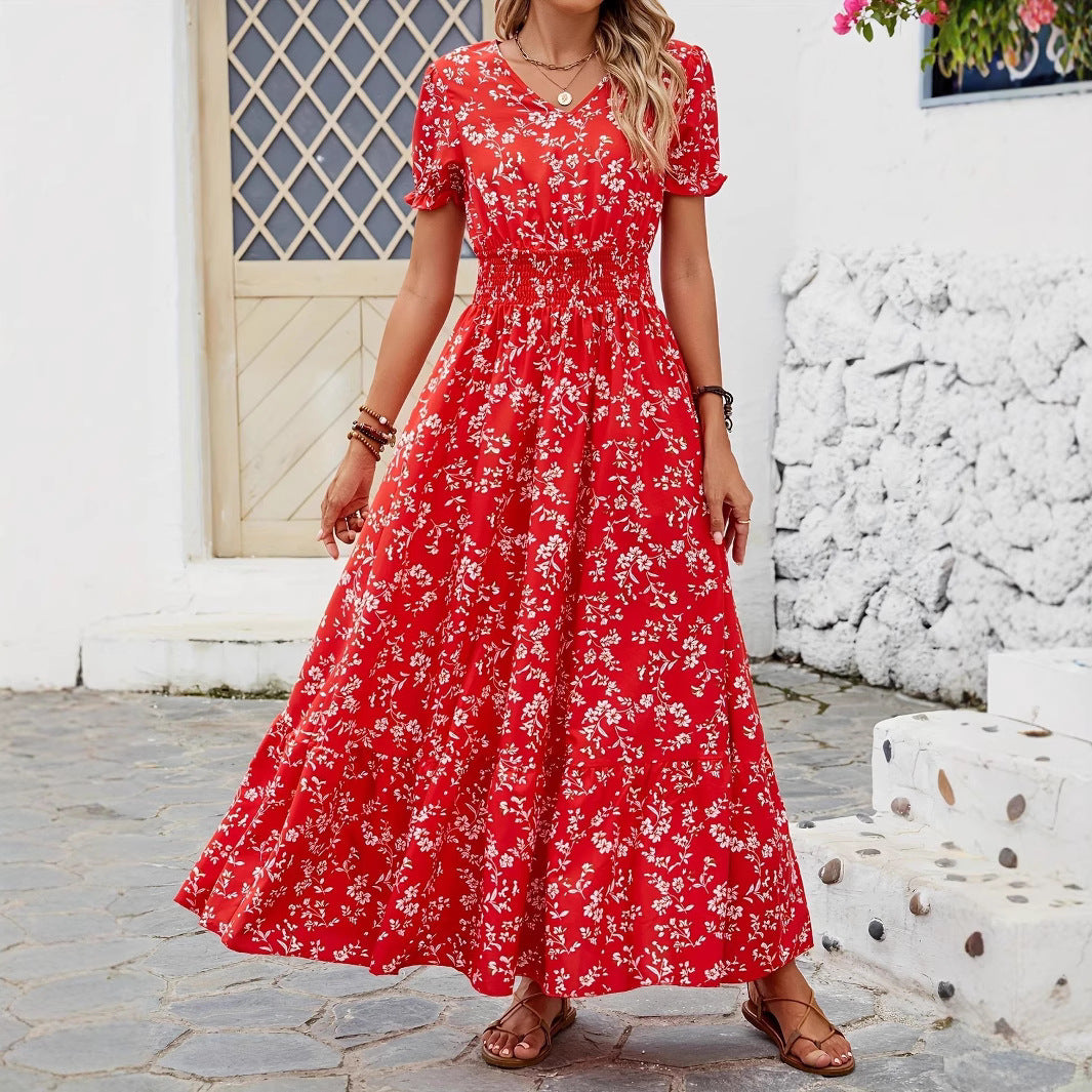 Dame Maxiklänning med elastisk midjesnörning och blomsterdetaljer Mirla-Eva Jonsson
