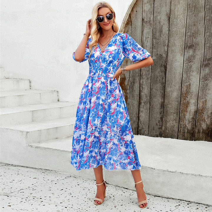Dame Midi Dress med eleganta puffärmar och romantisk blommönster Mirla-Eva Jonsson