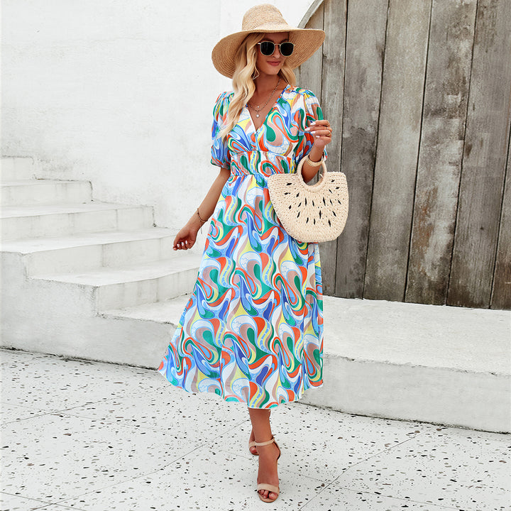 Dame Midi Dress med eleganta puffärmar och romantisk blommönster Mirla-Eva Jonsson