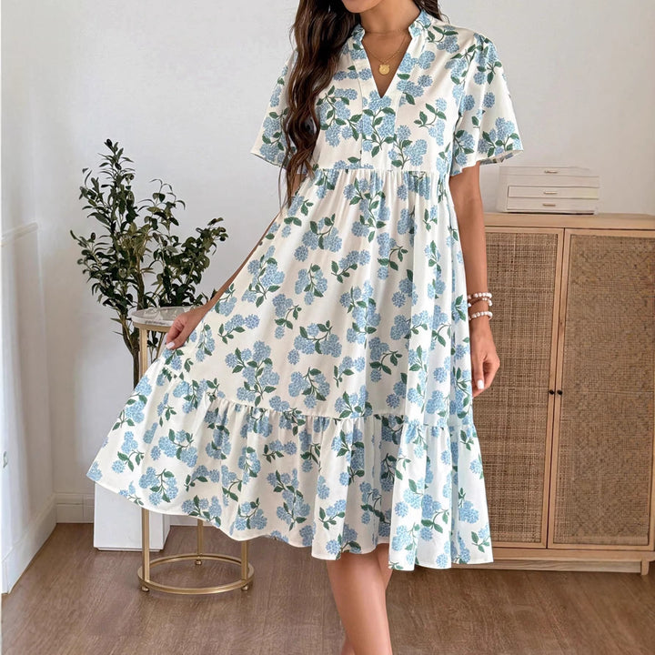 Dame Midiklänning med friskt blommönster och voluminös kjol Mirla-Eva Jonsson