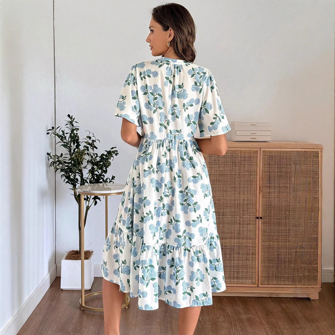 Dame Midiklänning med friskt blommönster och voluminös kjol Mirla-Eva Jonsson