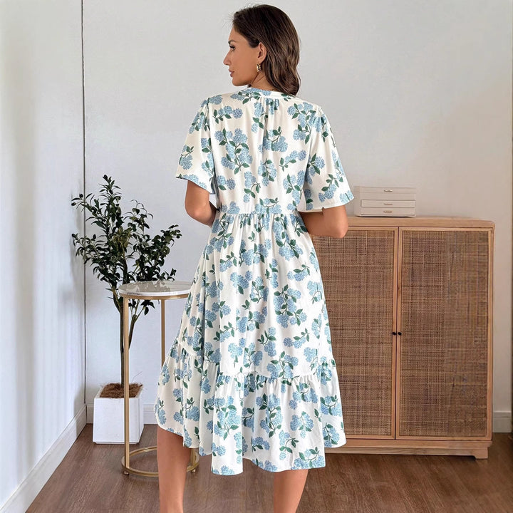 Dame Midiklänning med friskt blommönster och voluminös kjol Mirla-Eva Jonsson