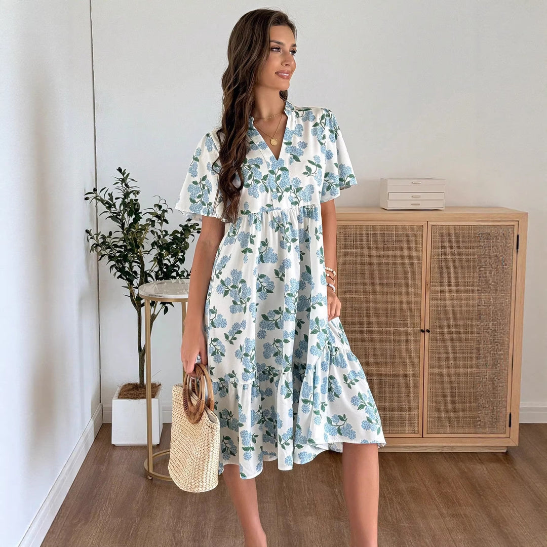 Dame Midiklänning med friskt blommönster och voluminös kjol Mirla-Eva Jonsson