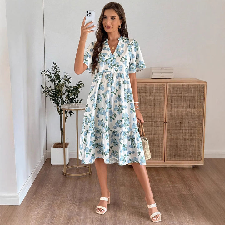Dame Midiklänning med friskt blommönster och voluminös kjol Mirla-Eva Jonsson