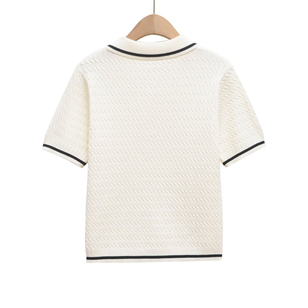 Dame Poloshirt med strukturerat material och eleganta knapppdetaljer Mirla-Eva Jonsson