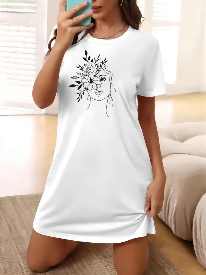 Dame T-shirt klänning med konstnärligt blommotiv och figurnära passform Mirla-Eva Jonsson