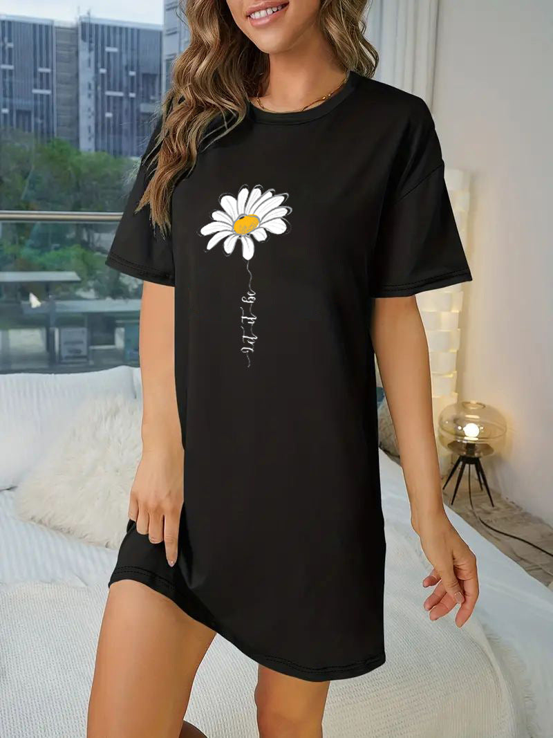 Dame T-shirt klänning med konstnärligt blommotiv och figurnära passform Mirla-Eva Jonsson