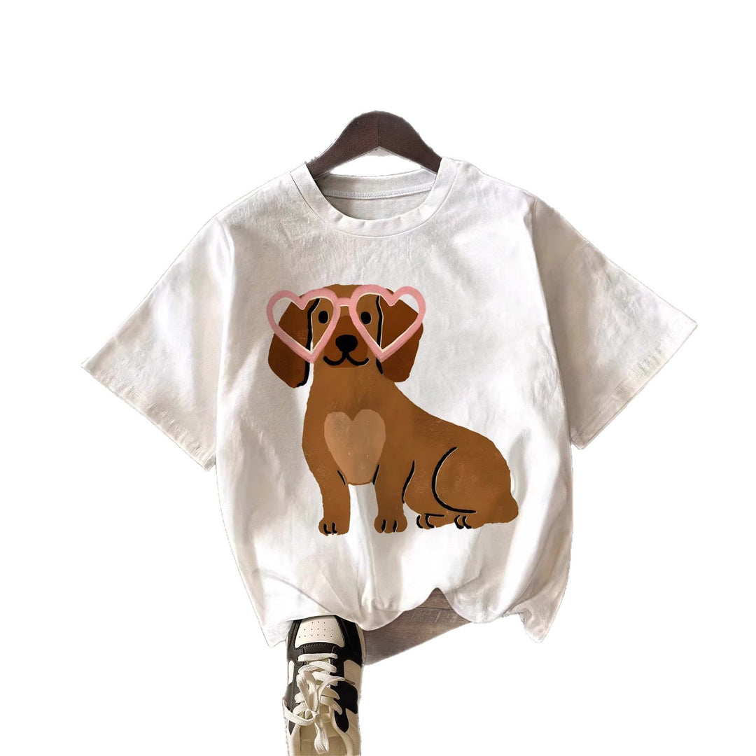 Dame T-shirt med gulligt hundmotiv och lekfull design Mirla-Eva Jonsson