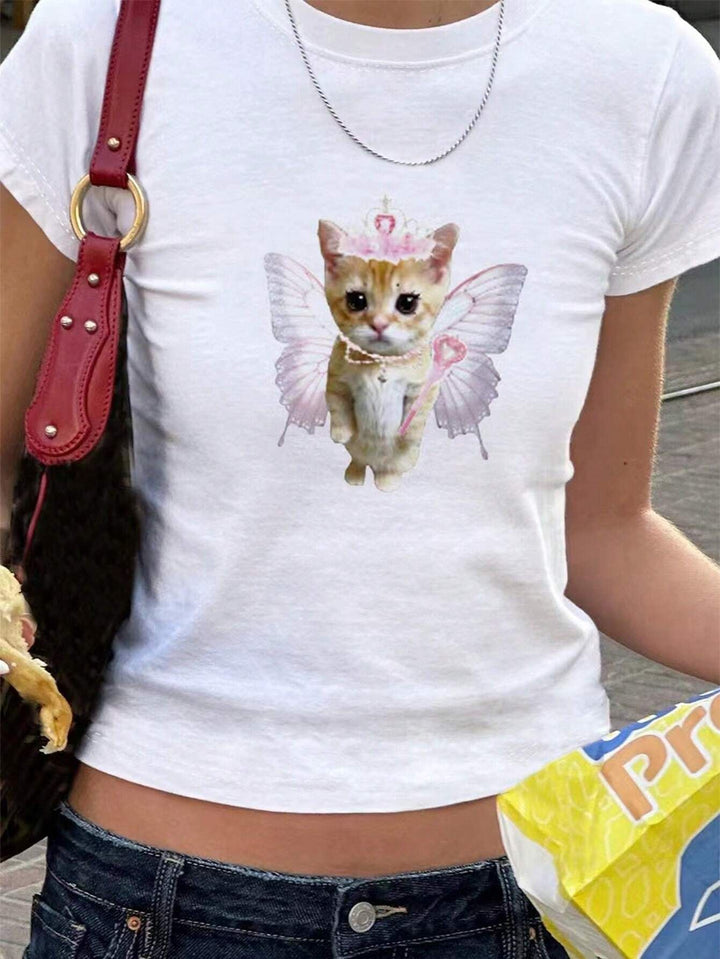 Dame T-shirt med lekfullt kattmotiv och ömma vingar Mirla-Eva Jonsson