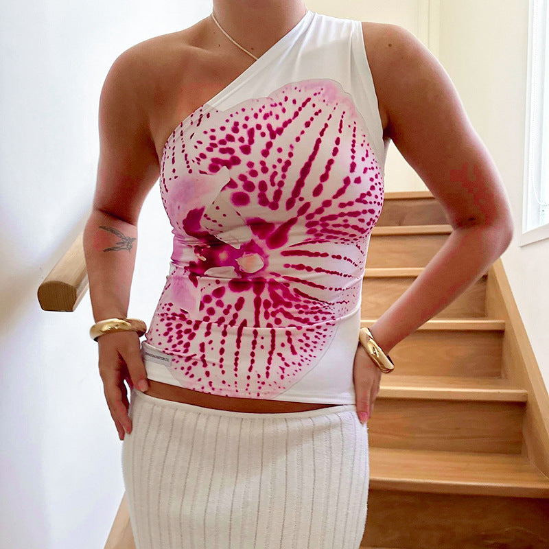 Dame asymmetrisk axeltröja med floralt tryckdesign Mirla-Eva Jonsson