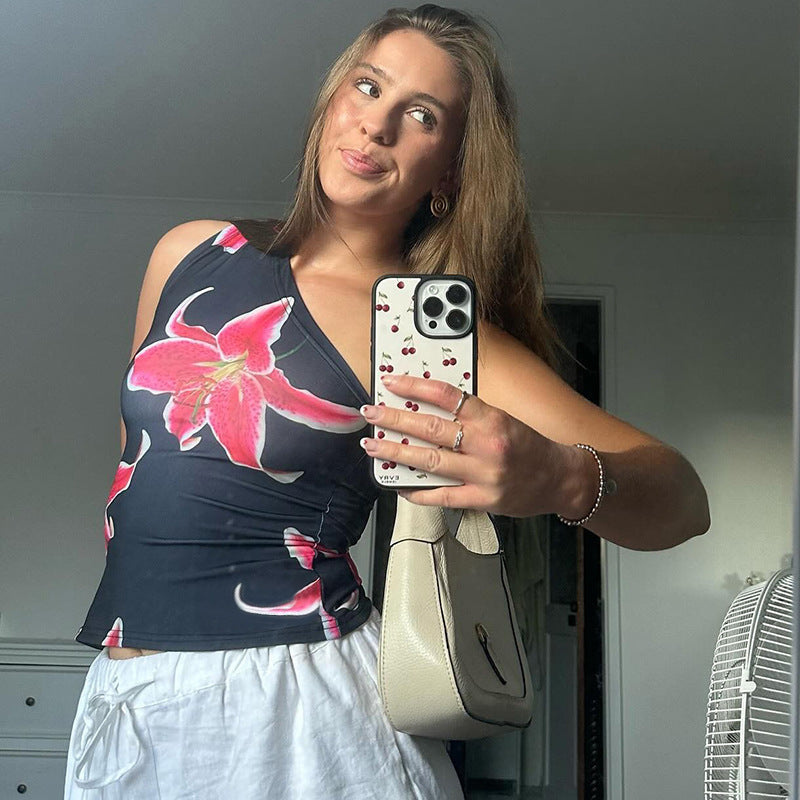 Dame asymmetrisk axeltröja med floralt tryckdesign Mirla-Eva Jonsson