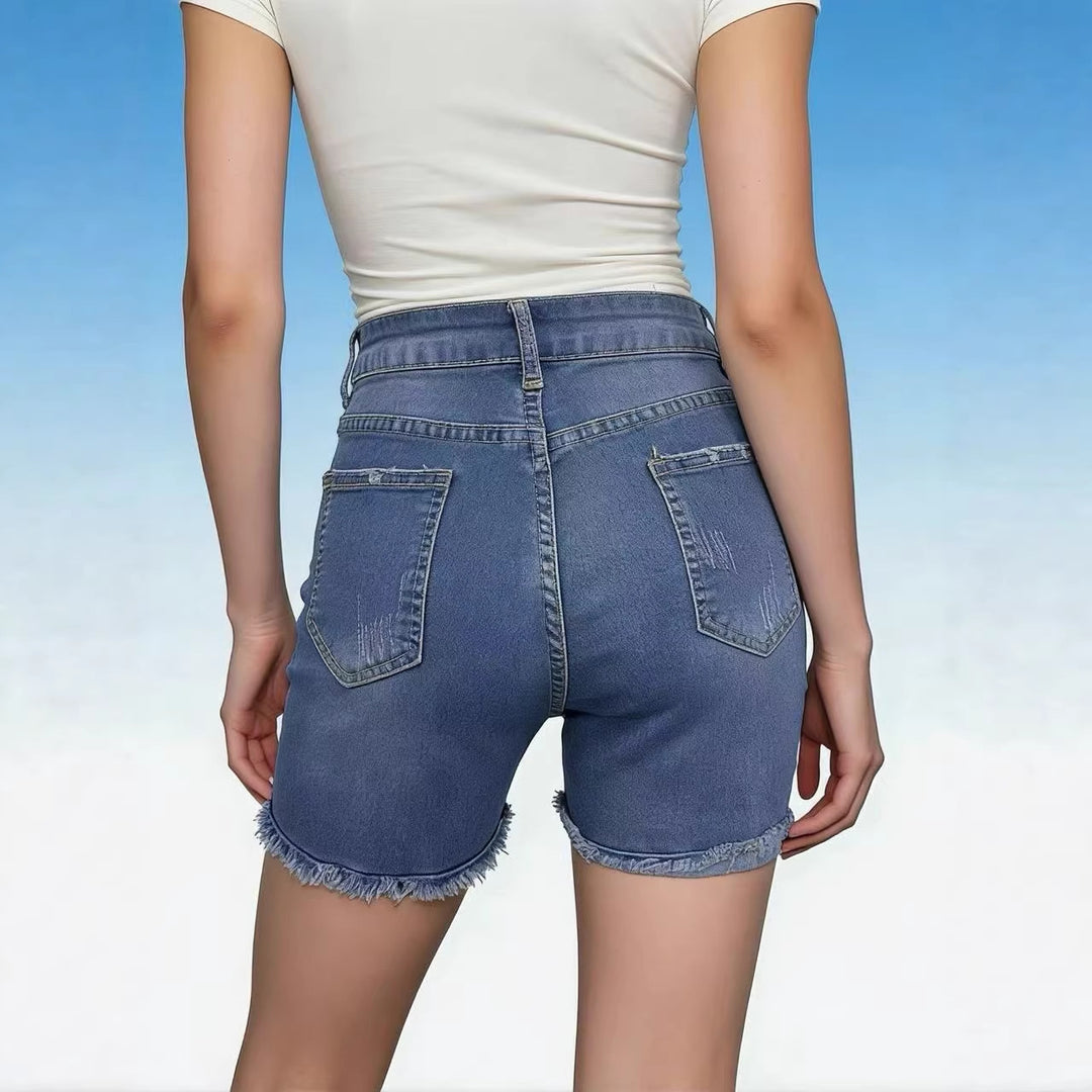 Dame avslappnade högmidjade denimshorts med fransar och trendiga förstörda detaljer Mirla-Eva Jonsson