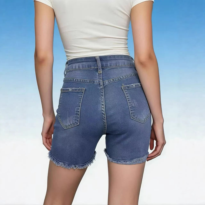Dame avslappnade högmidjade denimshorts med fransar och trendiga förstörda detaljer Mirla-Eva Jonsson