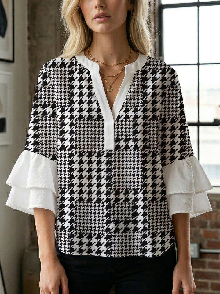 Dame blus med voluminösa volangärmar och modernt motiv Mirla-Eva Jonsson