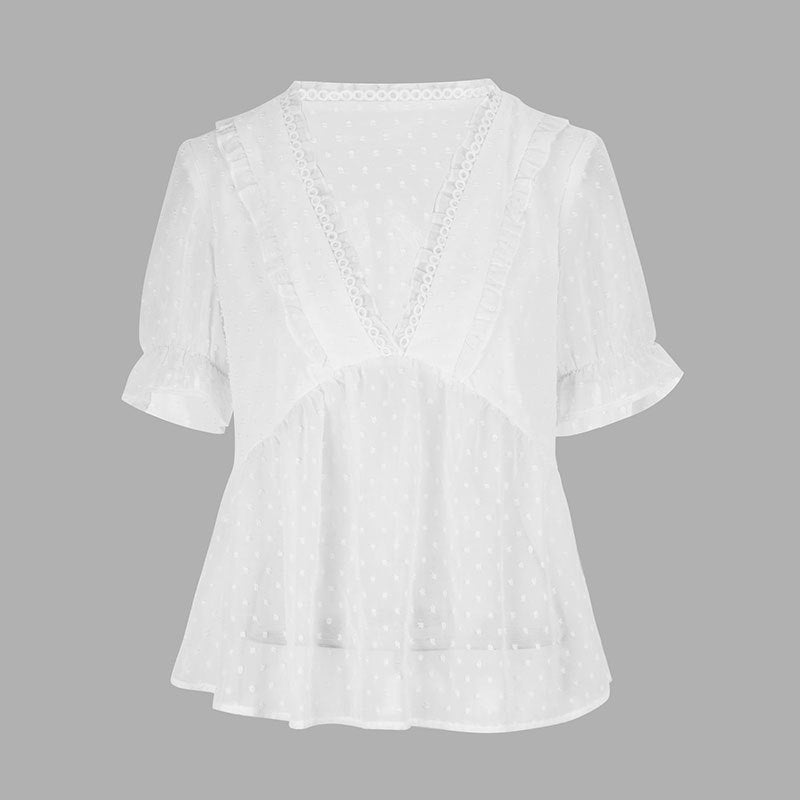 Dame blusenshirt med volangdetaljer och prickigt mönster Mirla-Eva Jonsson