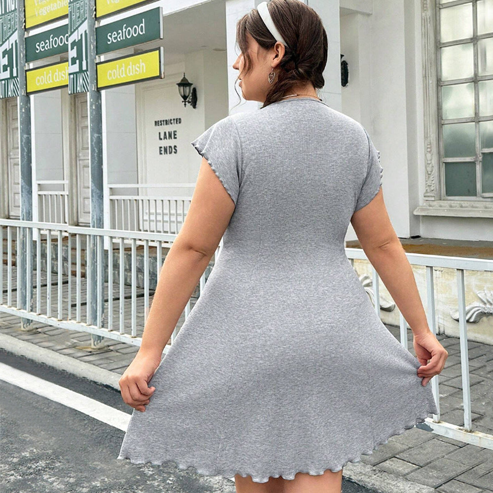 Dame casual Jersey dress with playful curved hem and decorative ribbons Mirla-Eva Jonsson