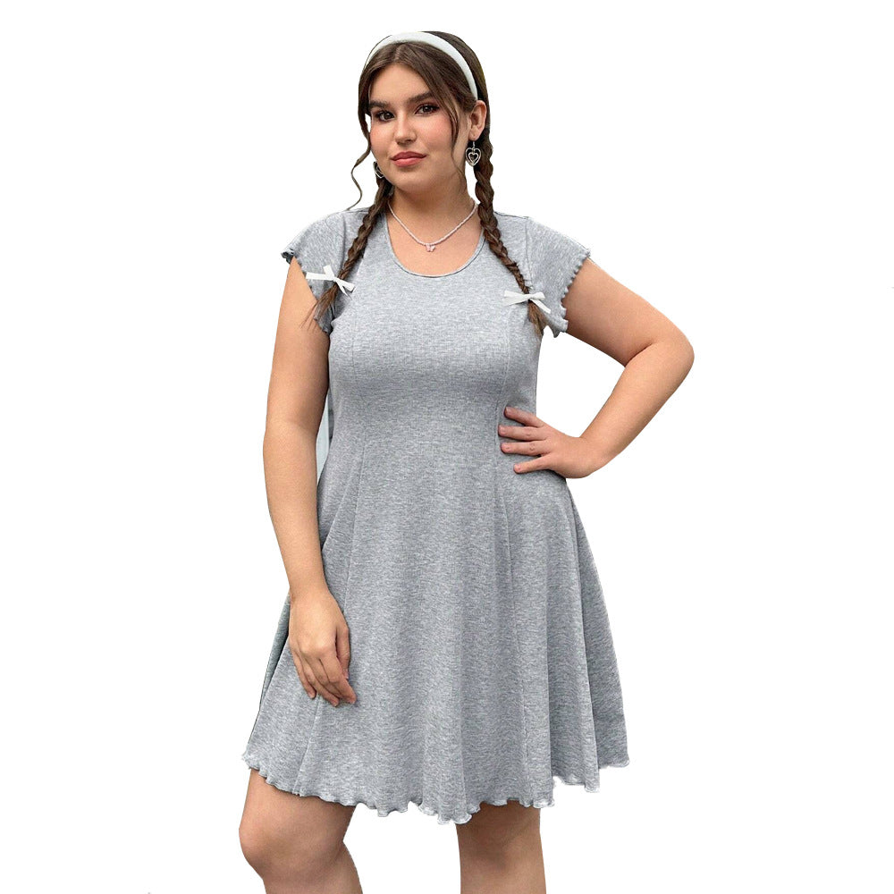 Dame casual Jersey dress with playful curved hem and decorative ribbons Mirla-Eva Jonsson